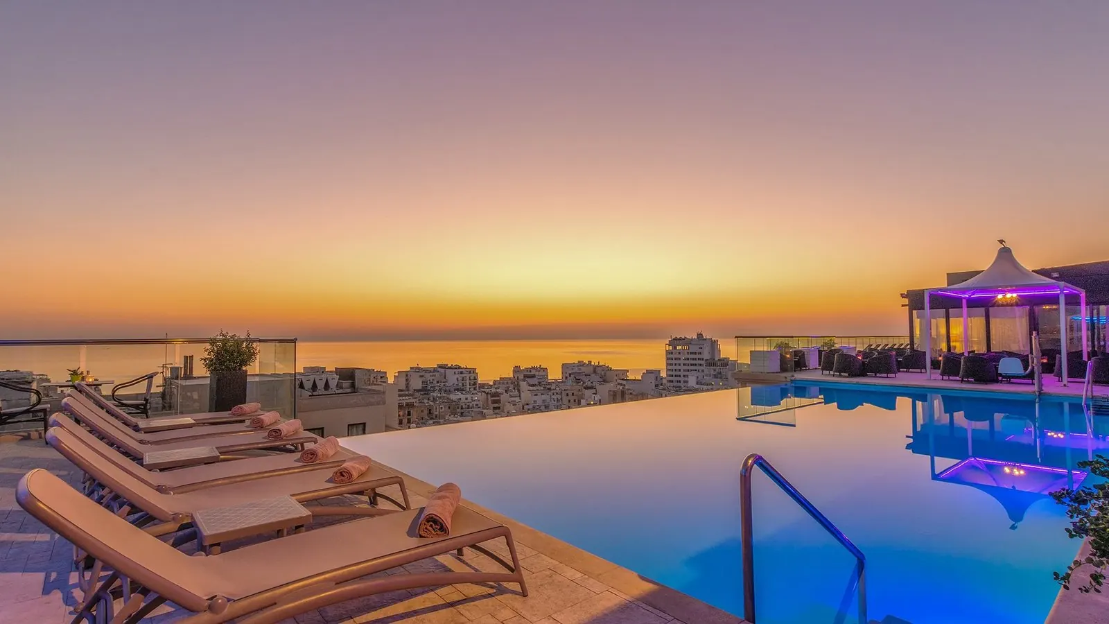 Rooftop pool at sunset from iStayMalta's existing photography